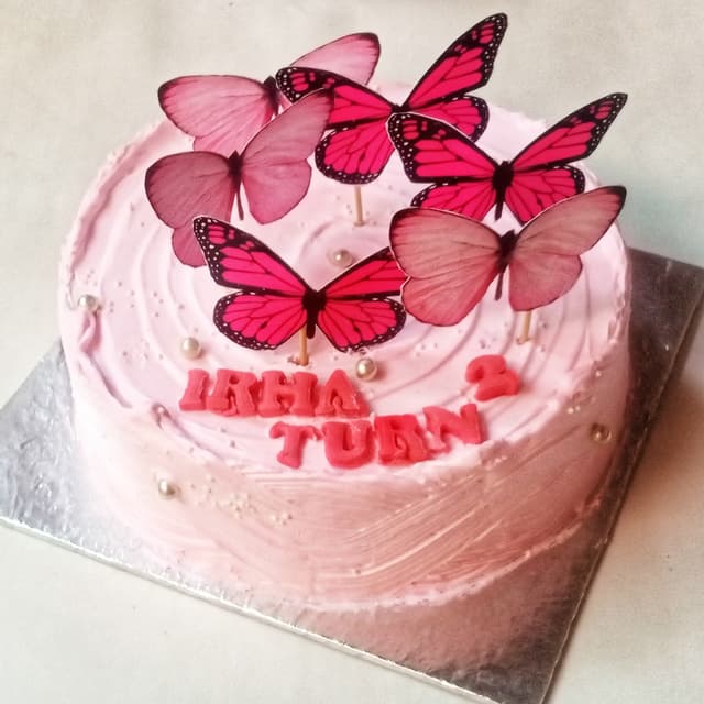 Pink butterflies theme cake
